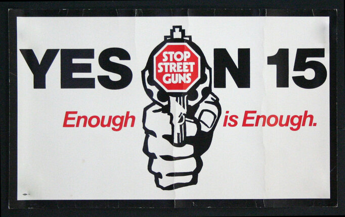 a sign with a hand holding a gun