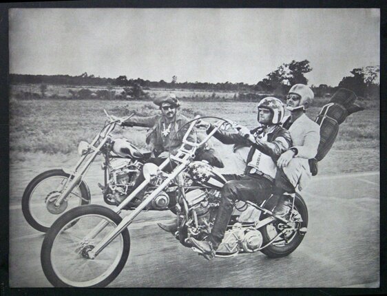 a group of men riding motorcycles