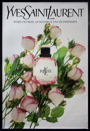 a poster of a perfume bottle and flowers