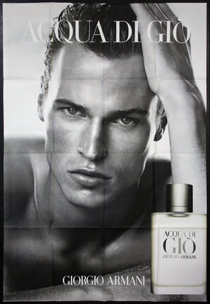 a poster of a man with a bottle of perfume