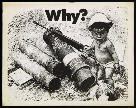 a child holding a gun next to a large barrel