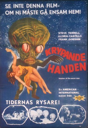 a movie poster with a green alien and a woman