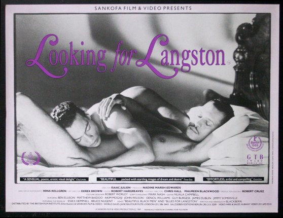 a poster of two men lying on a bed