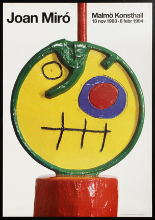 a yellow and green sculpture with a red and blue circle