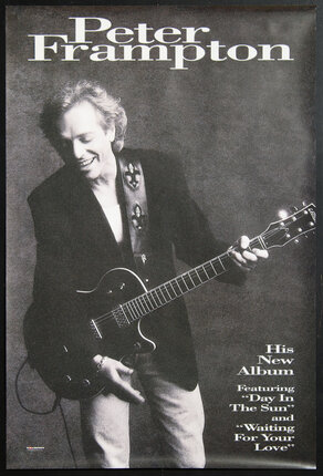 a man holding a guitar
