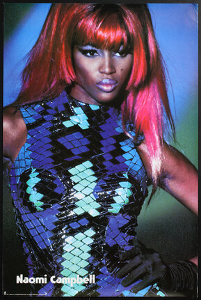 a woman with red hair and a blue and black dress