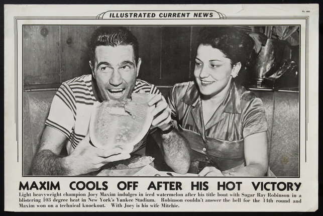 a man and woman eating watermelon