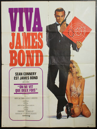 a movie poster with a man holding a gun and a woman in garment