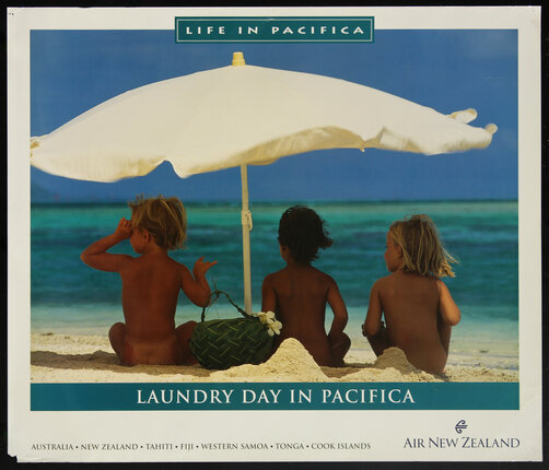 a group of children sitting under an umbrella on a beach