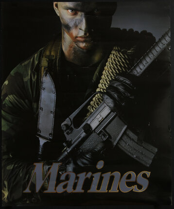 a man in camouflage holding a gun