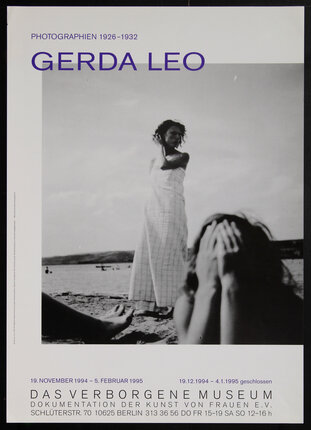 black and white photograph of a woman and child at a beach