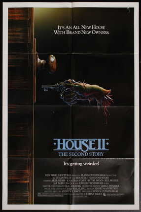 movie poster with a severed hand about to put a key in a door