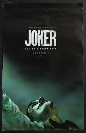 a movie poster of a clown looking up