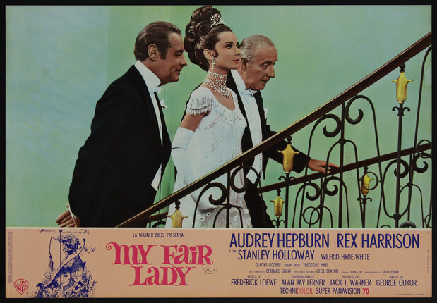 a movie poster with a film still of two men and a woman in fancy evening clothes ascending a staircase