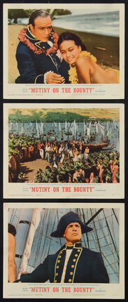three lobby cards with different scenes from Mutiny on the Bounty: a naval officer and woman on a bech, ships in harbor, and a naval officer