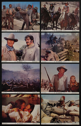 8 lobby cards with different movie scenes