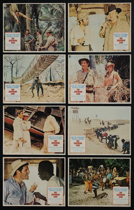 8 lobby cards with various film scenes in the desert and jungle