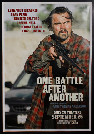 movie poster with Leonardo DiCaprio holding a rifle
