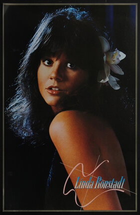 poster portrait of a woman (Linda Ronstadt) with a flower in her hair.