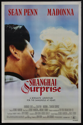 a movie poster with a man and a woman kissing