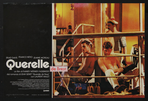 movie poster of men sitting behind ships railing