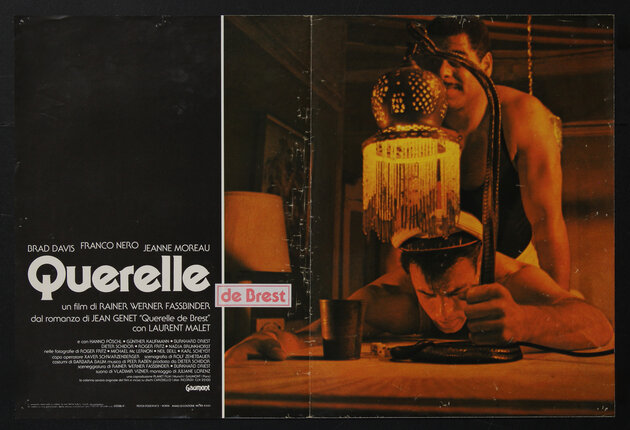 movie poster of a man standing behind another man who is leaned over a table while holding onto a table lamp
