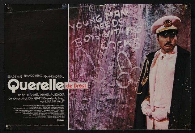 movie poster with a man in a uniform standing next to a wall with naughty graffiti that reads 