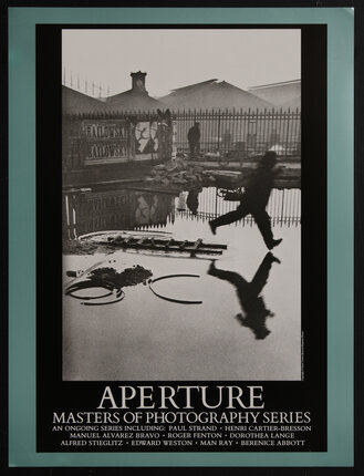 poster with a black and white photograph of a caught man jumping into a puddle