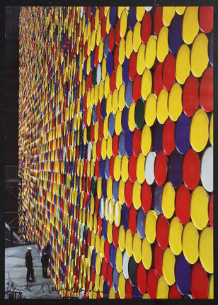 a poster with a wall of colorful oil drums