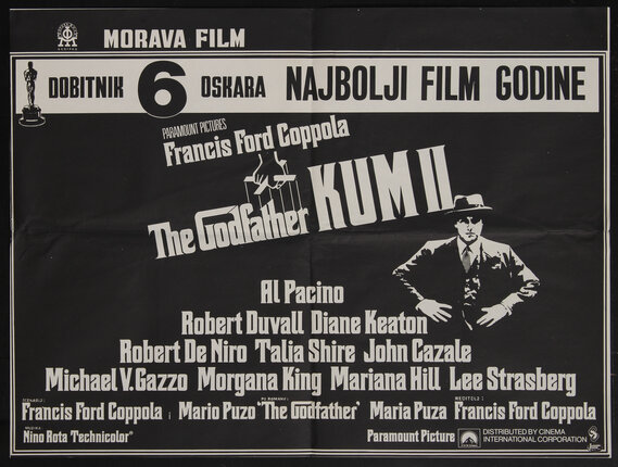 a movie cover with a man in a suit sitting in an easy chair and other film stills
