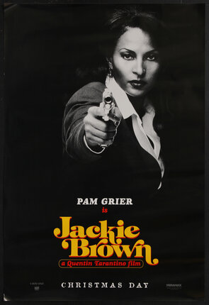a movie poster with Pam Grier pointing a gun