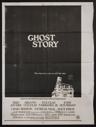 a poster with a haunted house and a full moon