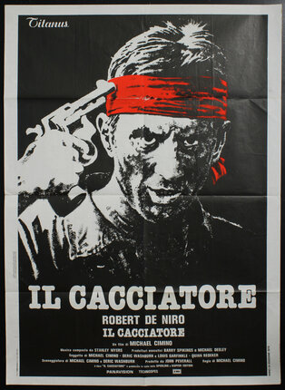 a poster of Robert de Niro with a gun and bandana