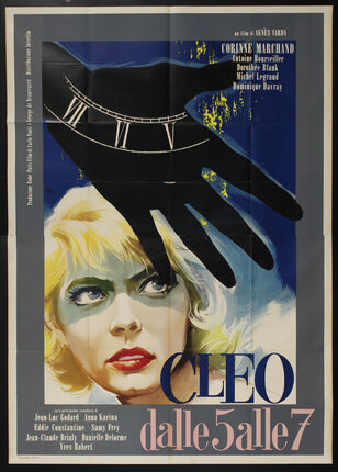 a movie poster with a hand, a clock, and a woman's face