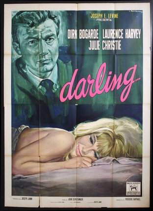 a movie poster of a woman lying on a bed with a man in a suit