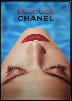 a woman with red lipstick and eyes closed