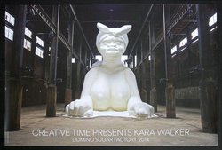 a large white statue in a warehouse