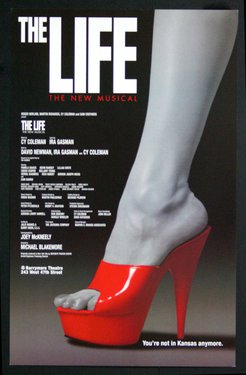 a magazine cover with a foot wearing a red high heeled shoe