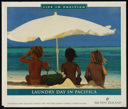 a group of children sitting under an umbrella on a beach