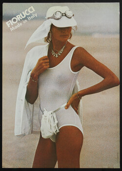 a woman in a white hat and white swimsuit