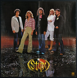music poster with a photograph of the five male members of the band Styx standing in various poses.