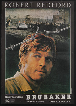 movie poster of a man with broken barbed wire above him