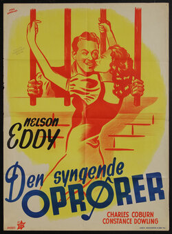 movie poster with man behind bars and a woman holding onto the bars